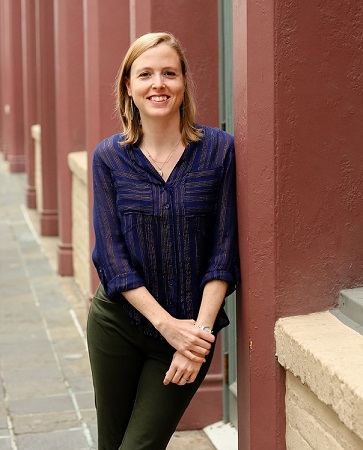 Photo of Amanda smiling at the camera.