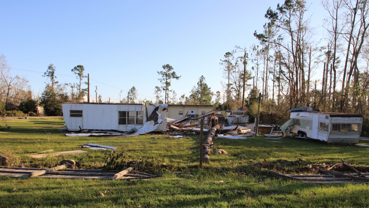 Down trees and damaged homes caused by winds from Hurricane Michael.